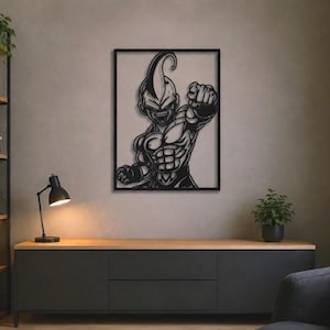 May include: A black metal wall art piece featuring a cutout silhouette of a muscular, fictional character with a pointed head and a clenched fist, framed within a rectangular border. The design displays bold lines and a dark, matte finish.