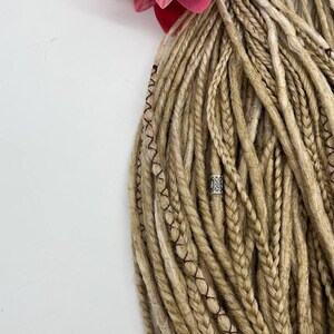 These are synthetic blonde dreads and braids. This set can be in two versions: double ended and single ended dreadlocks, or as they are called for short - DE and SE. This handmade set is made of absolutely safe synthetic material - Kanekalon.