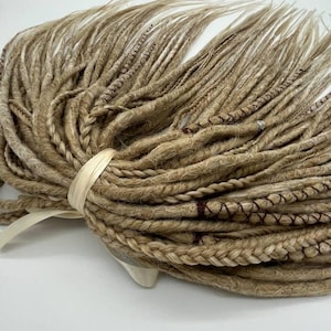 These are synthetic blonde dreads and braids. This set can be in two versions: double ended and single ended dreadlocks, or as they are called for short - DE and SE. This handmade set is made of absolutely safe synthetic material - Kanekalon.