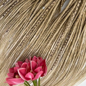 These are synthetic blonde dreads and braids. This set can be in two versions: double ended and single ended dreadlocks, or as they are called for short - DE and SE. This handmade set is made of absolutely safe synthetic material - Kanekalon.