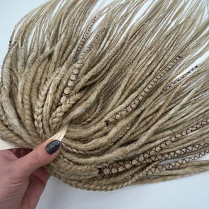 These are synthetic blonde dreads and braids. This set can be in two versions: double ended and single ended dreadlocks, or as they are called for short - DE and SE. This handmade set is made of absolutely safe synthetic material - Kanekalon.