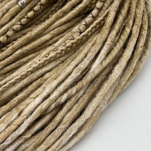 These are synthetic blonde dreads and braids. This set can be in two versions: double ended and single ended dreadlocks, or as they are called for short - DE and SE. This handmade set is made of absolutely safe synthetic material - Kanekalon.