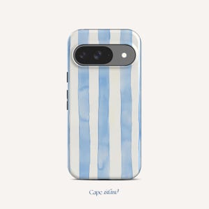 May include: A smartphone case featuring a watercolour design of vertical light blue stripes on a white background. The case has a camera cutout and the words "Cape Island" are printed at the bottom.