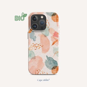May include: A phone case with a watercolor design featuring peach, blue, and orange abstract shapes. The case has a light beige background and the text "Cape Island" at the bottom. A green "BIO" logo is in the upper left corner.