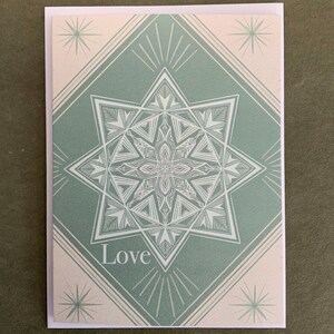 Tarjeta de felicitación con copos de nieve de amor