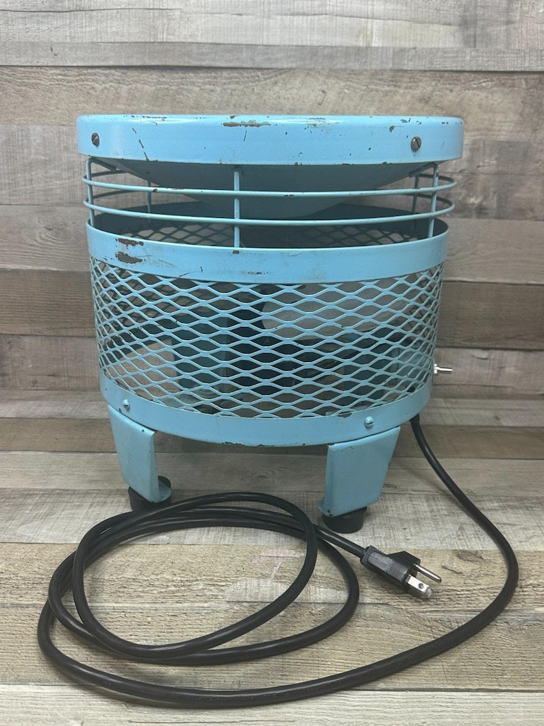 Taburete eléctrico vintage con ventilador de pie Emerson color turquesa, estilo art déco de los años 50, de metal. imagen 1
