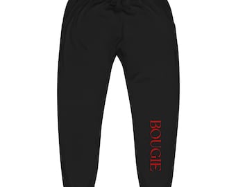May include: Black sweatpants with a drawstring waist and pockets. The word "BOUGIE" is printed vertically in red on the left leg. These comfortable sweatpants are suitable for casual wear.