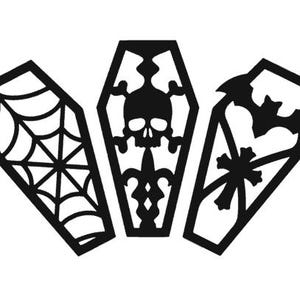 May include: Three black coffin-shaped cutouts with different Halloween-themed designs. The first cutout features a spider web, the second cutout features a skull and crossbones, and the third cutout features a bat.