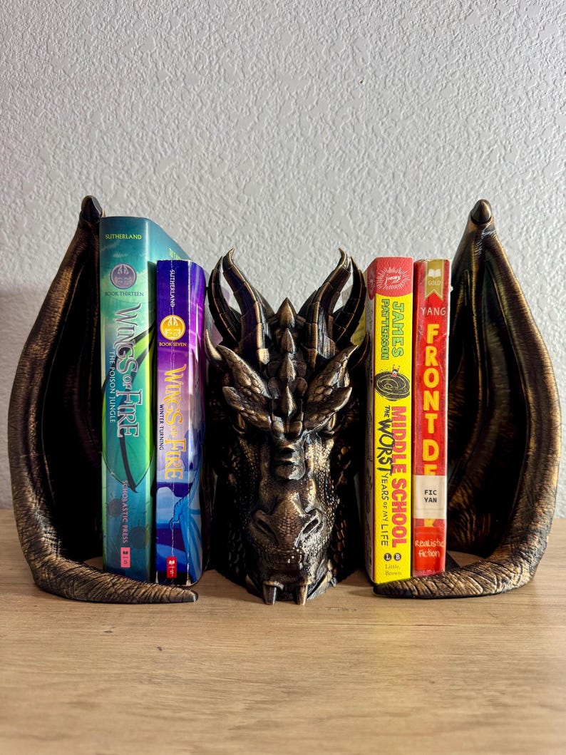 Dragon Bookend, Fantasy Bookend, Book Guardian Decor, Hand Painted Dragon Bookend, Color Changing Bookend, Dragon Shelf Decor, Book Protector Dragon, Fantasy Bookshelf Accessory, Antique Gold Dragon Decor, Dual Color Bookend, Dragon Bookend with Antique Gold Highlights, Dragon Bookend for Fantasy Lovers, Bookend That Looks Like a Dragon Guarding Books, Decorative Dragon Bookend for Bookshelves, Fantasy Decor Bookend with Custom Color Options, book lover gifts, book lover, book gift, onyx storm