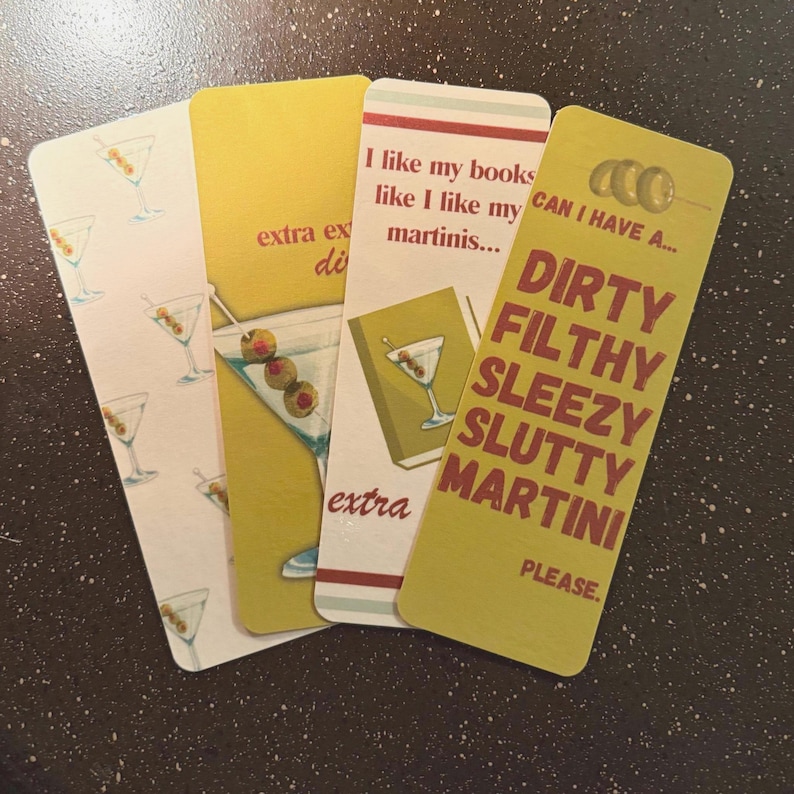 May include: Four yellow bookmarks with a martini glass design. The text on the bookmarks reads "I like my books like I like my martinis...", "extra extra dirty", and "CAN I HAVE A... DIRTY FILTHY SLEEZY SLUTTY MARTINI PLEASE."