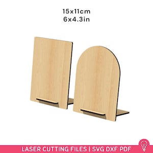 May include: Two wooden display stands, one rectangular and one arched, each with a small base. The dimensions are 6 x 4.3 inches and 15 x 11 cm. The stands are made of light-colored wood. The text "LASER CUTTING FILES | SVG DXF PDF" is at the bottom.