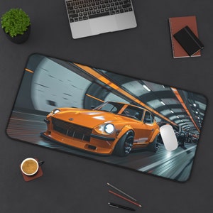 May include: An orange sports car mousepad with a tunnel design. The car is the focal point, with a sleek, aerodynamic design and black wheels. The background features a blurred tunnel with orange accents.