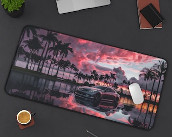 May include: A black car with a sunset and palm trees in the background. The car is reflecting in the water. The mousepad is made of a soft, durable material and is perfect for gamers and anyone who spends a lot of time at their desk.