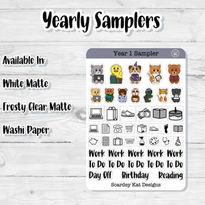 May include: A sheet of planner stickers labeled "Yearly Samplers" with the text "Year 1 Sampler." The stickers feature cartoon animals, icons, and phrases like "Work," "To Do," "Day Off," "Birthday," and "Reading."