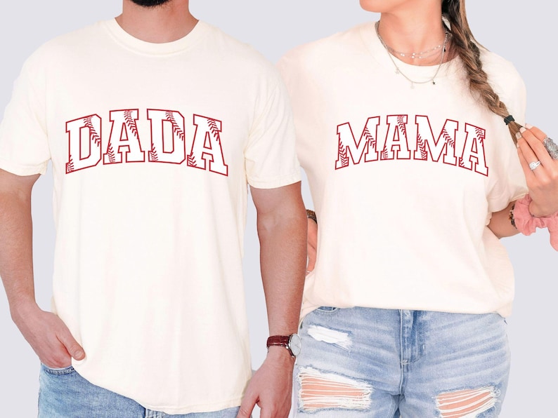 May include: Two white t-shirts with red baseball-themed text. One shirt says "DADA" and the other says "MAMA".
