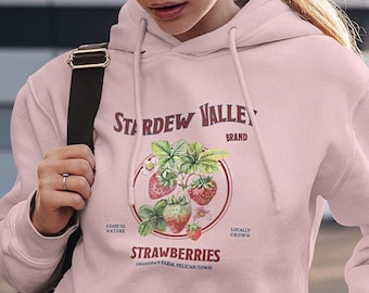 Felpa unisex Stardew Valley, regalo di tendenza per videogiocatori, comoda per i gamer, Pelican Town, grafica con fragole, merchandising di Stardew, stile botanico retrò