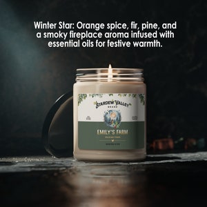 May include: A lit candle in a glass jar with a label that reads "Emily's Farm" and "Winter Star". The label also includes the text "Stardew Valley Brand". The candle has a festive, warm aroma of orange spice, fir, pine, and a smoky fireplace.
