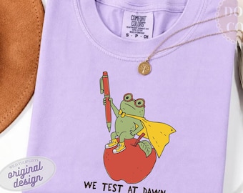 We Test at Dawn T-Shirt, Comfort Colors Frog Teacher Exam Day Shirt, Teacher Humour Gift