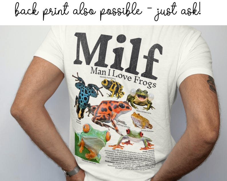May include: Cream-colored t-shirt with the text "Milf Man I Love Frogs" in black. The shirt features a colorful graphic of various frog species. The phrase "back print also possible - just ask!" is at the top.