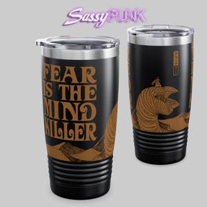 May include: A black stainless steel tumbler with a brown graphic of a sandworm from the movie Dune. The text "Fear is the mind killer" is printed on the tumbler in a retro font.