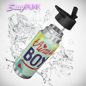 May include: A stainless steel water bottle with a colourful design featuring the text "thirsty boy" with a heart and a red arrow. The bottle has a black lid with a straw.