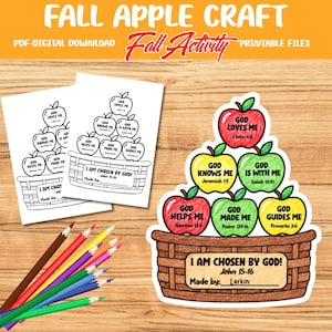 May include: A digital download craft activity featuring a basket of apples with text including "God Loves Me" and "I Am Chosen By God." The set includes black and white printable pages and a colored example, accompanied by several colored pencils.