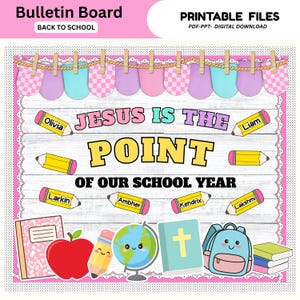 May include: A digital bulletin board display featuring the text "JESUS IS THE POINT OF OUR SCHOOL YEAR" on a white wood background. The design includes colorful pencil graphics with names, a globe, a red apple, a book, and a blue backpack.