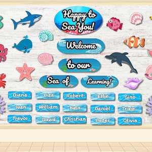 May include: A wooden classroom sign with a sea life theme. The sign includes various sea creatures, decorative elements, and the phrases "Happy to Sea You!", "Welcome to our Sea of Learning!", and student names.
