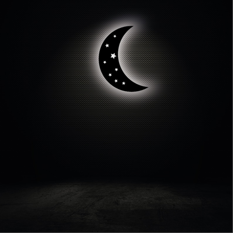 May include: A black crescent moon with white stars on a dark background.