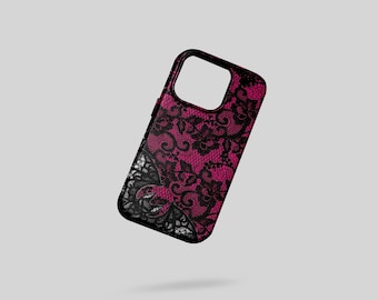 May include: A black phone case with a pink background and a black lace overlay. The case has a glossy finish and a cutout for the camera. The lace design is intricate and detailed, creating a stylish accessory.