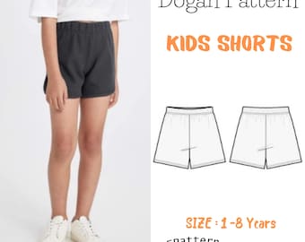 May include: A digital pattern for kids shorts, sizes 1-8 years. The pattern includes a PDF pattern and a tutorial. The image shows a child wearing black shorts and a white t-shirt.
