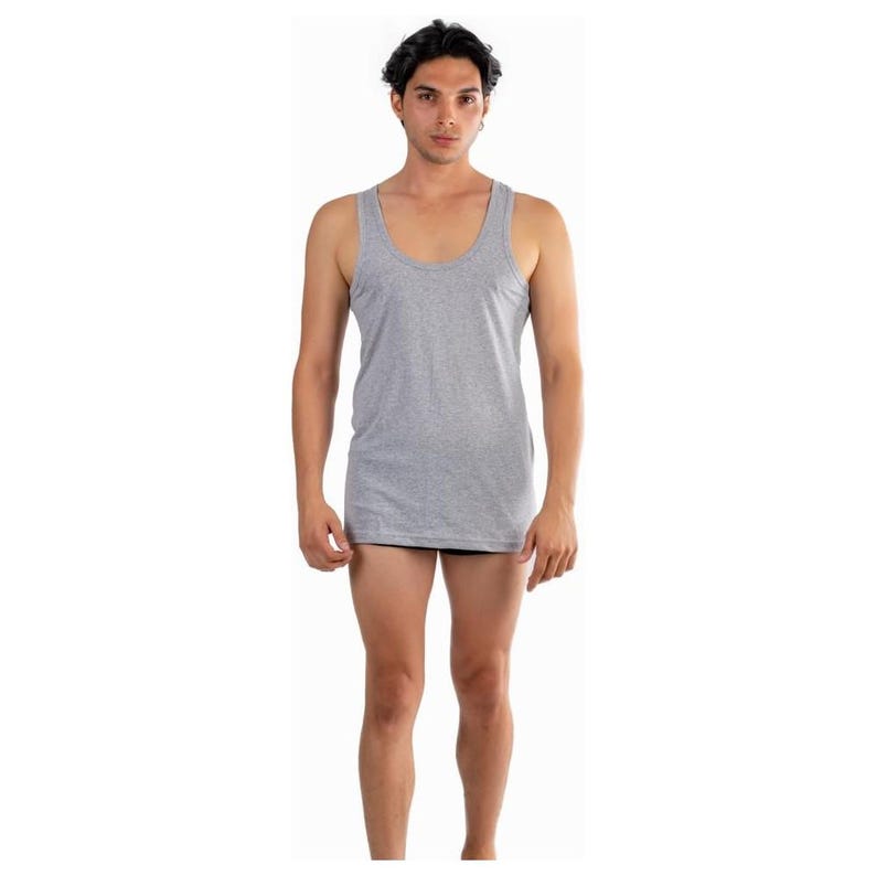 May include: A grey sleeveless undershirt with a scoop neck.