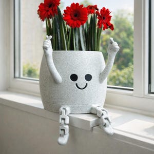 May include: A set of three ceramic mugs with a speckled, matte finish. The mugs are in shades of cream, light gray, and dark gray. Each mug has a simple, minimalist design and a rounded handle. Perfect for coffee or tea.