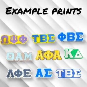May include: Nine different examples of Greek letter sorority and fraternity prints. The prints are in various colors, including yellow, blue, green, purple, and white. The letters are raised and have a 3D effect.