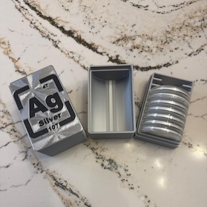 3d printed Silver 1 ounce coin holder display box. Holds (10) 1 ounce coins.  Clear Coin cases included. Personalized side if you choose