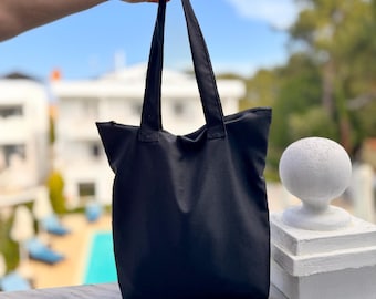 Black tote bag with zipper, Casual travel bag, Minimalist stylish design, With inner pocket, Practical gift, Versatile tote bag with zip.