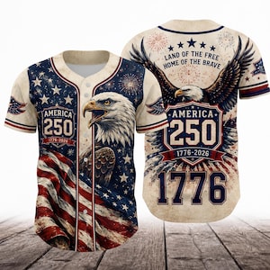 May include: A button-down baseball jersey featuring a cream, red, and blue patriotic design. The front displays a bald eagle, American flag, and text reading AMERICA 250 1776-2026. The back shows a large eagle, fireworks, and text LAND OF THE FREE HOME OF THE BRAVE.