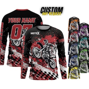 May include: Long-sleeved motocross shirts in various colors, featuring a rider on a motorcycle with the text "MOTOX" and "RAI". The shirts have a black base with red splatter and checkered flag designs. The text "CUSTOM ANY REQUEST" is also visible.