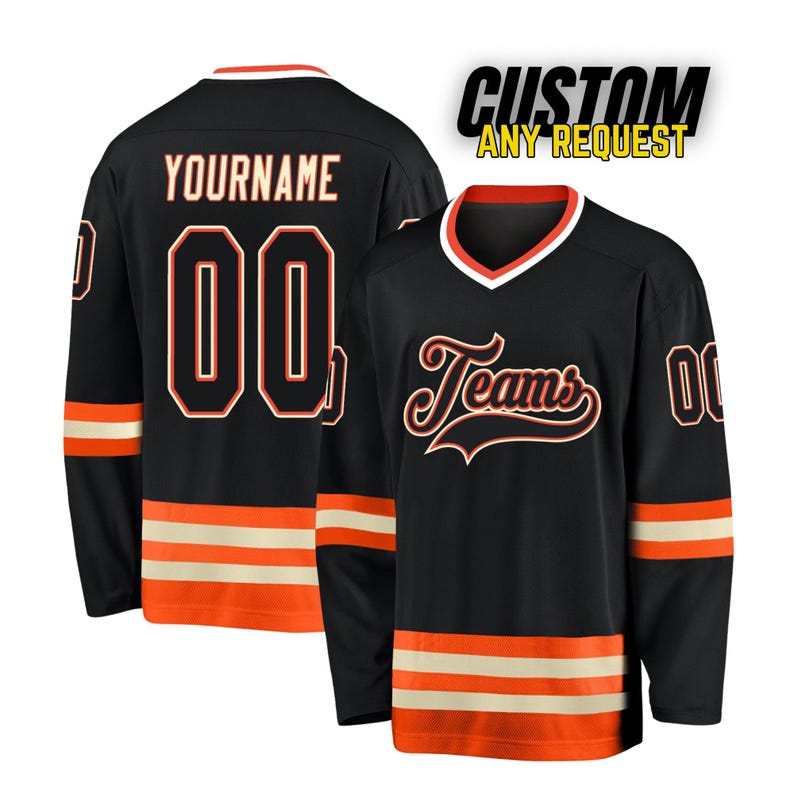 May include: Black hockey jersey with orange and white stripes. The jersey has the word "Teams" in a retro font on the front and a customizable number and name on the back.