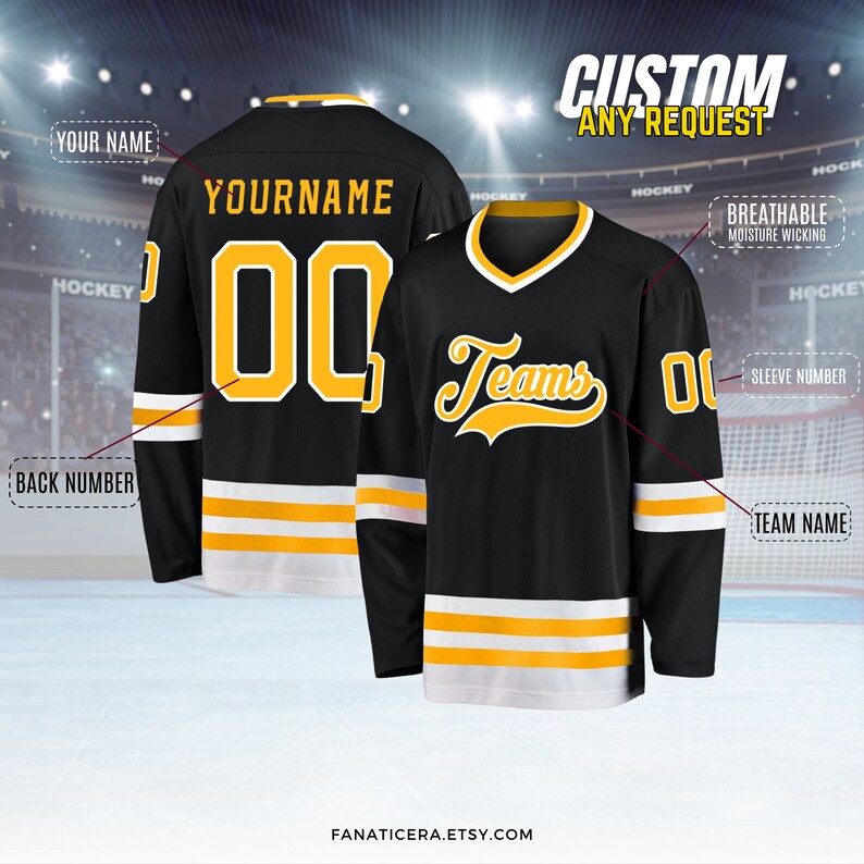 May include: Black hockey jersey with yellow and white stripes. The jersey has a team name "Teams" in yellow script on the front and a number "00" on the back. The jersey is customizable with a name and number.