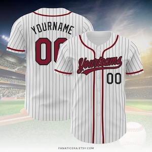 May include: White baseball jersey with black pinstripes and red trim. The jersey has "Your Name" and "00" on the back and "Your Team" and "00" on the front.