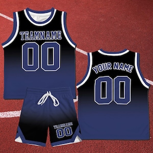 May include: A black and blue basketball jersey with white trim and a black and blue pair of shorts with white trim. The jersey has the text "TEAM NAME" and the number "00" on the front. The shorts have the text "TEAM NAME" and the number "00" on the back.