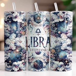 May include: A stainless steel tumbler with a colorful design featuring a Libra zodiac symbol, clouds, stars, and the text "LIBRA STEPHANIE".