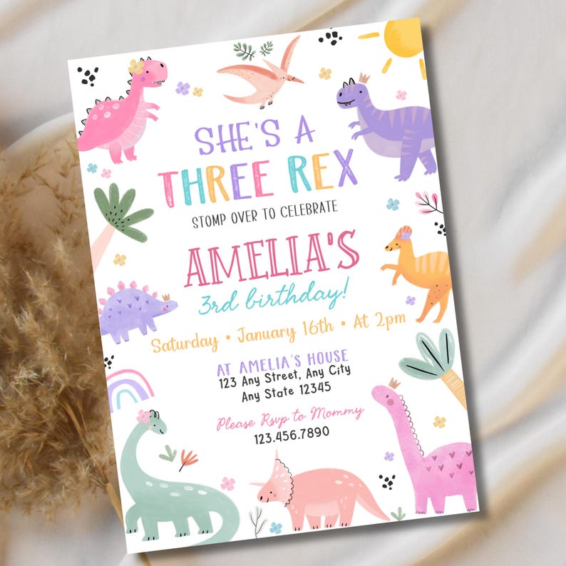 May include: A colorful invitation for Amelia's 3rd birthday, featuring dinosaur illustrations in pink, purple, and green. The text reads "She's a Three Rex" and includes party details: date, time, and location.