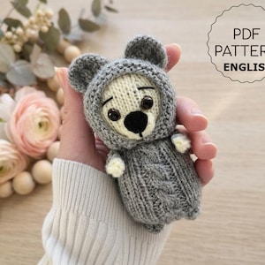 May include: A set of three ceramic mugs with a speckled, matte finish. The mugs are in shades of cream, light grey, and dark grey. Each mug has a simple, minimalist design, ideal for coffee or tea.