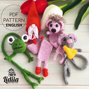 May include: A collection of handmade knitted toys, including a green frog, a gnome, a hedgehog, and a mouse. The gnome wears a red hat and has a white beard. The text "PDF PATTERN ENGLISH" is visible.