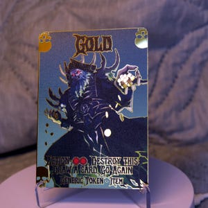 Ficha de metal dorada con huesos de la tumba para Flesh and Blood TCG High Seas