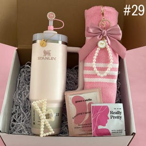Blanket Gift Box Set For Grandma, Mom, Aunt
30 oz Rose Quartz Stanley
Straw Topper
Initial Tumbler Handle Charm
Pink Turkish Throw
Pearl Hair Claw
Eye Mask
Makeup Remover Towel