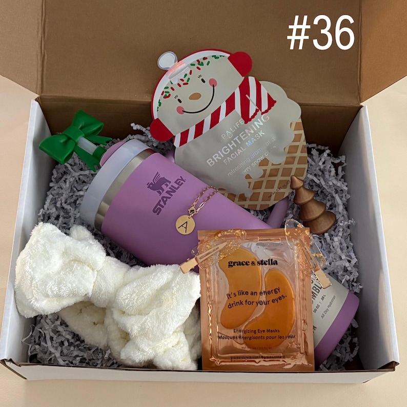 Tumbler Gift Set 
Includes:
30 oz Lilac Stanley
Straw Topper
Initial Tumbler Handle Charm
Xmas Face Mask
Gold Christmas Tree
Eye Mask
Hair Clips
Spa Headband