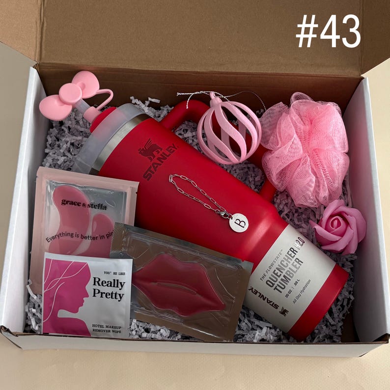 Gift Box For Women 
Includes:
30 oz Red Stanley
Straw Topper
Initial Tumbler Handle Charm
Pink Velvet Ornament
Pink Shower Pouf
Rose Soap
Eye Mask
Lip Mask
Makeup Remover Wipe